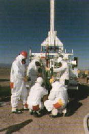 Health physicists check radiation levels at a nuclear weapons test site